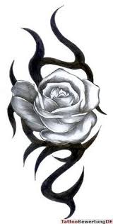 Black colour designs across rose enhance rose tattoo. 75 Tribal Rose Tattoo Ideas Designs