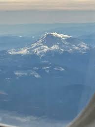 View of Mt. Shasta from airplane window flying into Medford, Oregon