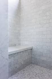This tile combines a brilliant white color with distinct streaks of gray in a smooth finish to create a great complement for your decor. Carrera Marble Hex Floor Tiles Accent A Walk In Shower Fitted With Gray Marble Subway Surround Tiles And A T Master Shower Tile Bathroom Tile Diy Master Shower
