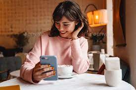 Brunette Young Woman Drinking Coffee Using Mobile Phone Coffee Uses Used Mobile Phones Business Portrait