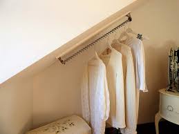 Small hanging rails for clothes. Waterfall Clothes Hanging Rail Rack Storage For Sloping Angled Ceilin Tiny S Home In 2020 Hanging Rail Angled Ceilings Small Dressing Rooms