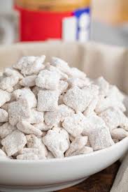 Puppy chow is a popular dessert or snack made with peanut butter, melted chocolate, and crunchy chex cereal. White Chocolate Puppy Chow Muddy Buddies Dinner Then Dessert