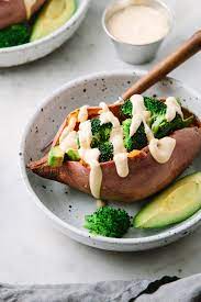 Vegan Stuffed Sweet Potatoes Recipe Features Tender Baked Sweet Potatoes Stuffed With Brocco Vegan Sweet Potato Sweet Potato Recipes Sweet Potato Recipes Baked