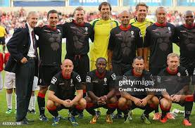 Former Manchester United youth coach Eric Harrison, left, lines up... News  Photo