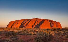 Relax with a glass of sparkling wine and light refreshments as the sun sets in the west. Uluru At Sunset Australia