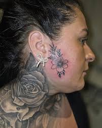 Finger tattoos and pretty flower for...