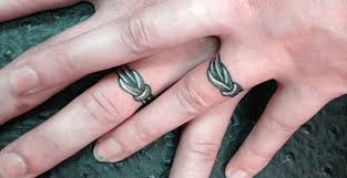 Simple, modern lines work great for both bride and groom. Tattoo Wedding Ring Ideas Wedding Ring Tattoos With Initials