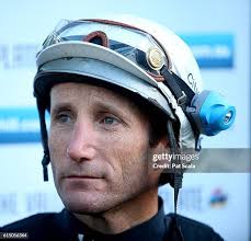Trackrider Alex Olive hands over the reins to jockey Damien Oliver... News  Photo