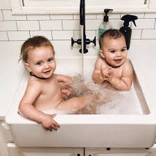 Pour the water over your head. Bathing Babies In The Kitchen Sink Tubby Todd Bath Co Facebook