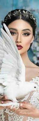 The forehead is black, as are the wings which also have white markings. On The Wings Of A Dove Feather Wedding Pure Products Beautiful