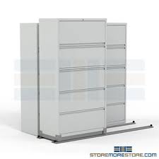Sliding mobile shelving units save space in offices and warehouses by sliding back and forth on tracks. 2 1 Sliding Lateral Filing Cabinets On Rails 42 Wide File Cabinet File Cabinets On Tracks High Density Files Sliding File Cabinets Space Saver File Cabinets Moving