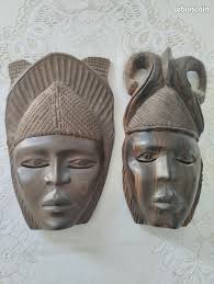 Deux masques africain sculptés bois à suspendre