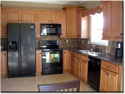 kitchen cabinets with black appliances