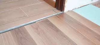 Where one floor meets another type of flooring, you will have to install some sort of transition piece. Vinyl Plank Flooring Transition Between Rooms Vinyl Flooring Online
