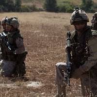 Gunnery Sergeant Derek Strasser (left), Administration