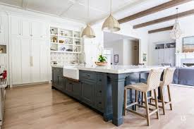 The warmth of the orange accents is tempered by the cool blue and brick tones. Our Favorite Blue Kitchen Cabinet Paint Colors Christopher Scott Cabinetry