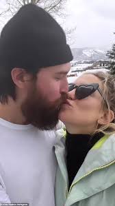 Kate Hudson shares a quick kiss and lots of smiles with her fiancé Danny  Fujikawa