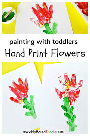 Painting with flowers setting up the materials: Hand Print Flower Paintings For Toddlers My Bored Toddler