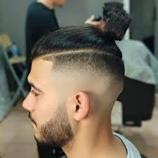 The 'fade' effect is shown by the gradual shorter length of hair, which emphasizes the top. Pin On Haircut