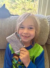 Young boy learns tailoring skills quickly