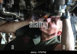 U.S. Marine Corps Cpl. Travis Hilton, electrician with Combat Logistics  Battalion 2, screws a fuel line