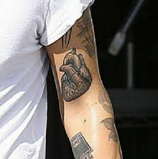Harry styles one direction updated tattoos sweatshirt 4.8 out of 5 stars 28 ratings | 14 answered questions currently unavailable. Jo On Twitter Harry Styles The Guy Who Literally Tattoos A Real Human Heart Tattoo On His Arm Http T Co Zy8olk7f0t