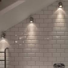 I'd like to use recessed led lighting along the short wall but unfortunately the joists are 2x4s which leaves me little room for such niceties. Wall Spot Light Wall Mounted Light In A Sloping Bathroom Ceiling Sloped Ceiling Bathroom Bathroom Spotlights Bathroom Ceiling Light