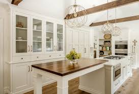 In this kitchen the soapstone provides the only color accent in this otherwise white on white kitchen, which makes it stand out even more. New York White Soapstone Countertops Kitchen Farmhouse With Wood Counter On Island Front Sinks Cabinets