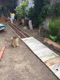 The garden path enhances any backyard. The Shingled House Backyard Walkway