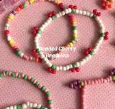 Beaded Cherry Bracelets 🍒 So easy and cute as can be! Find more bracelets  tutorials now on the PLG blog! Link on profile! #braceletmaking  #seedbeadjewelry #cherryseason #diyjewelry #seedbeadbracelet
