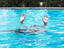 active boy diving and raising hands in