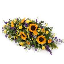 Send and deliver funeral flowers to home of the deceased person in italy, to church or to cemetery. Purple Gold Casket Spray Funeral Flowers London