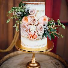 Frost the exterior of the cake with the remaining frosting, and use a spoon to make swirls for a textured exterior. 85 Of The Prettiest Floral Wedding Cakes