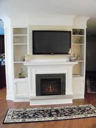 Building Book Cases Around A Faux Fireplace Google Search With Images Fireplace Built Ins Built In Electric Fireplace Fireplace Entertainment Center