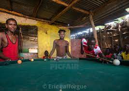 Young men playing snooker pool, Omo valley, Kangate, Ethiopia - License,  download or print for £71.55 | Photos | Picfair