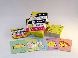 As in snap and dobble, each player places a card from their hand face up into a community pile while saying taco/cat/goat/cheese/pizza in player sequence. Taco Cat Goat Cheese Pizza Card Game Acd Toys Bens