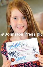 25015305-Pictures Martin Bostock Schoolchildren from Blackpool schools at a  special party at Blackpool football club to celebrate their 100%  attendance. Bethany Middleton of Stanley school.