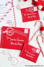 Santa's elves, santa face, reindeers, sleigh with santa and reindeers (with rudolph!), candy canes, wonderful presents, snow at the north pole, snowed you can find printable santa claus envelopes with the address of santa, stamp and postage stamp, too. Diy Letter To Santa Felt Envelope Giggles Galore