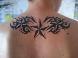 Both men and women have got horoscope tattoos inked on their bodies since time immemorial and the practice of doing such a thing proves that humans have blind faith on their. Nautical Stars And Tribal Tattoo On Man Upper Back