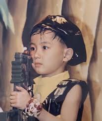 Netizens wonder how The Boyz's Hyunjae managed to grow bigger without his  face changing at all since his baby days