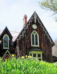 Decorative touches abound, including elaborate buttresses, lacy pinnacles, and decorative tracery in the leaded glass windows. Gothic Revival Style The Craftsman Blog