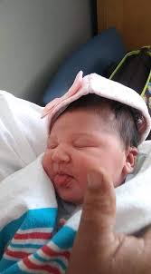 Please would anybody be able to remove the two hands to the left of the  little boy and the hand