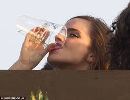 Emma Watson downs her beer at Taylor Swift's Hyde Park festival gig