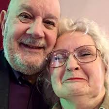 What team and cups are in the grandad's football team photo?