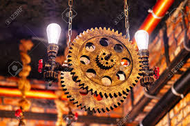 Whether you choose one type of steampunk home decor or the other, you must know you will bring a distinct industrial style to your place. Steampunk Architectural Style Design Element Of Interior Lamp Bulbs Fixed On Iron Industrial Gear Cogwheels Sprocket Lighting Illuminated Equipment Hanging Indoors Stock Photo Picture And Royalty Free Image Image 117774235