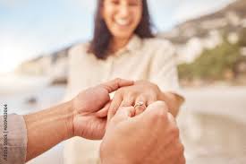 Pov, engagement and woman with ring on hand at beach with smile ...