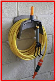We offer varying lengths of hoses, hose savers, coiled hoses and more! Garden Hose Holder Menards Garden Hose Holder Garden Hose Hose Holder