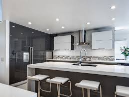 High Gloss Cabinetry White Quartz Countertops Waterfall Edges White Quartz Countertop Modern Kitchen Quartz Quartz Countertops