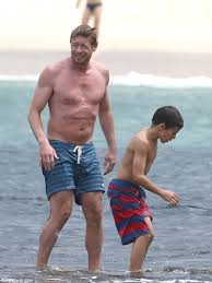 Cute shirtless boy with brown hair splashes water on his face against a black background young handsome persian teenage boy shirtless against gray backgr. Shirtless The Mentalist Star Simon Baker Displays Muscular Physique While Down Under At Bondi Beach With His Family Daily Mail Online