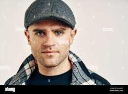 Man in peaky blinders style cap hi-res stock photography and images